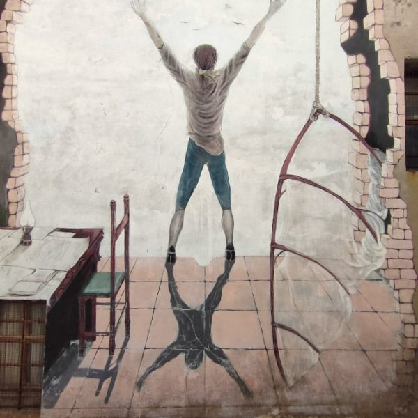 Murales Giovane di spalle - borgo di Saludecio (RN)